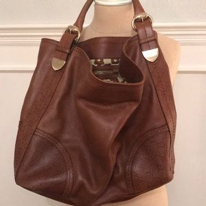 With Gucci tan leather monogram